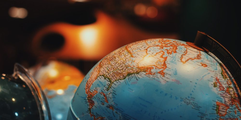 selective focus photo of terrestrial desk globe